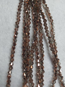 beads bicone 4mm clear half plated copper