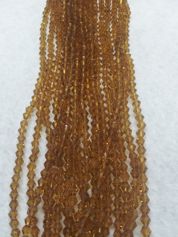 beads bicone 4mm clear dark golden yellow