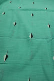 turquoise green slub cotton with embroidered leaf design