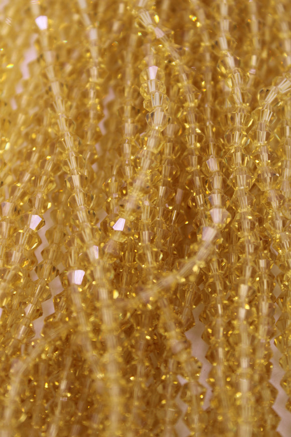 beads bicone 4mm clear light golden yellow